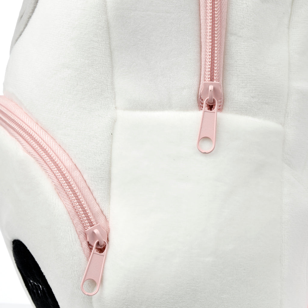 Close-up of the pink zip and soft white plush fabric on Astra unicorn bag.