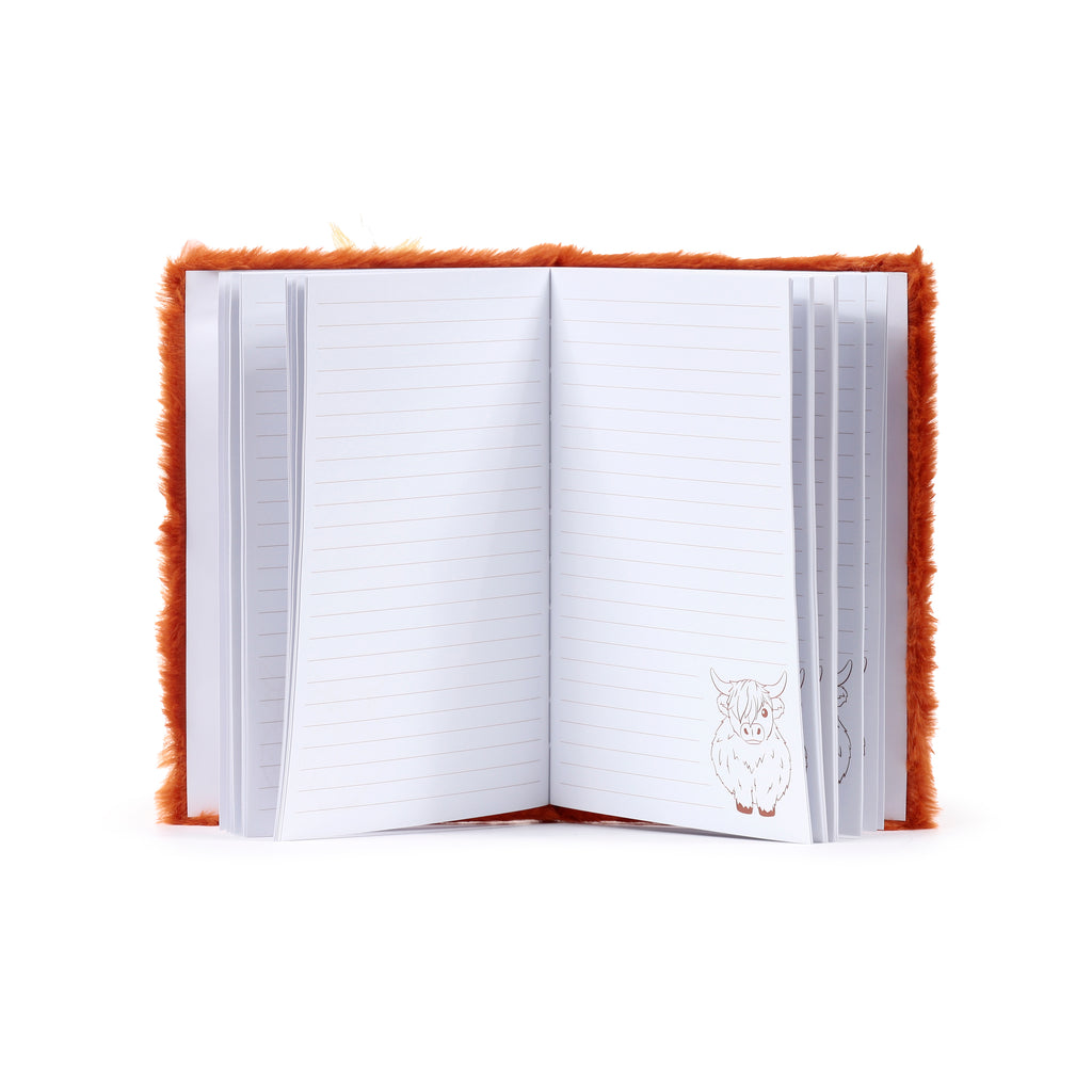 Open view of a shaggy ginger Highland Cow notebook featuring long-pile faux fur, an embroidered winking face, and soft plush horns.