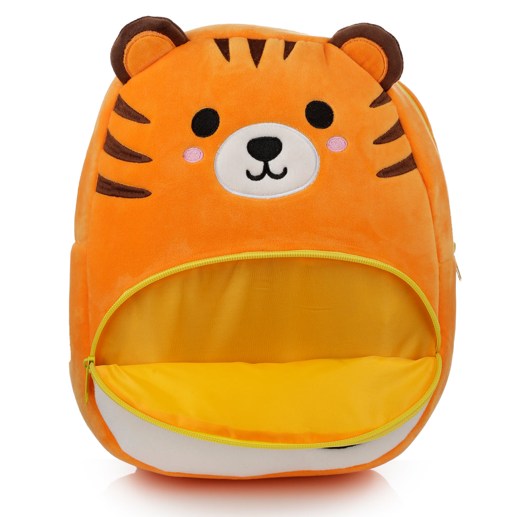 Open main compartment of tiger backpack showing space for nursery school supplies.