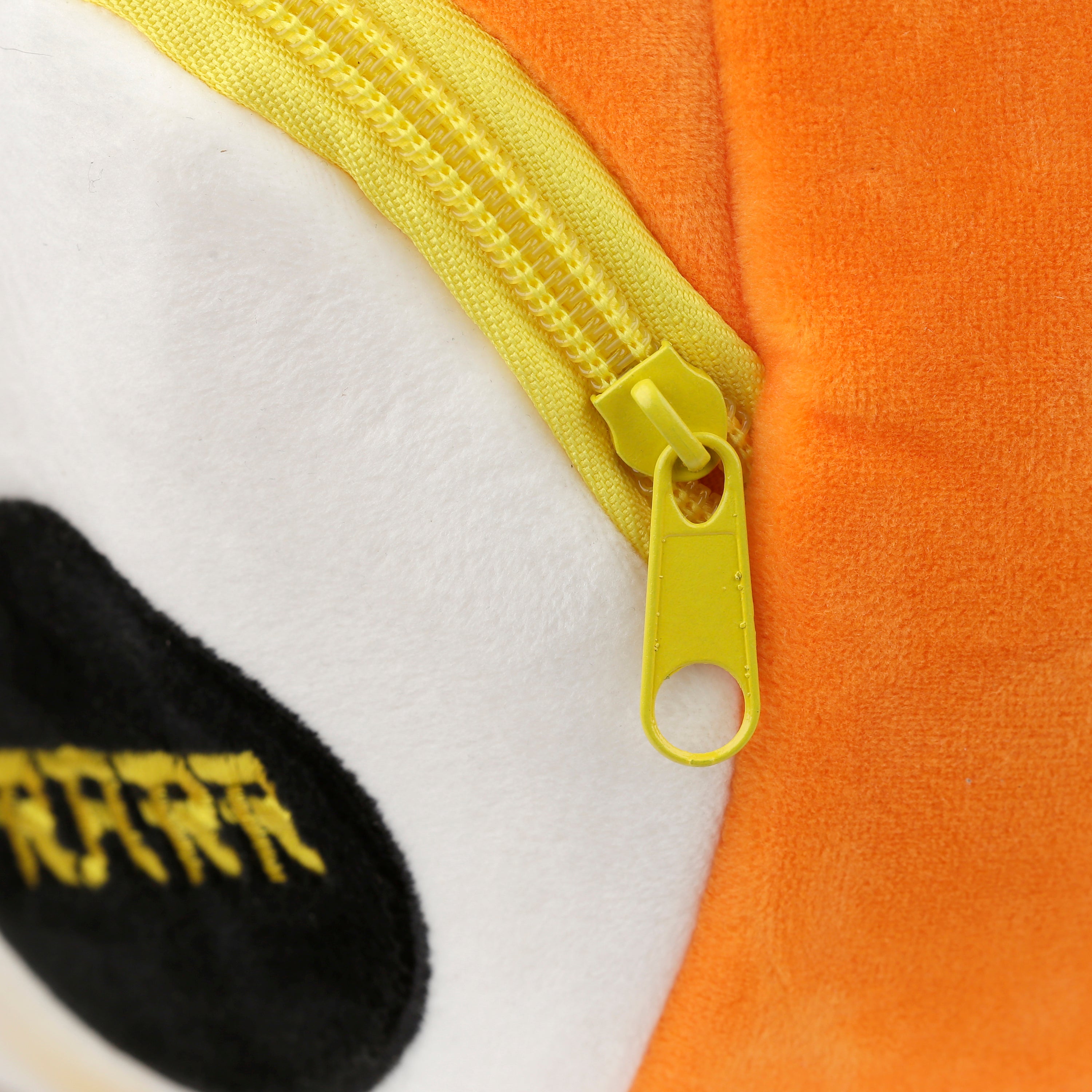 Close-up of the bright yellow zippers and  orange fabric.