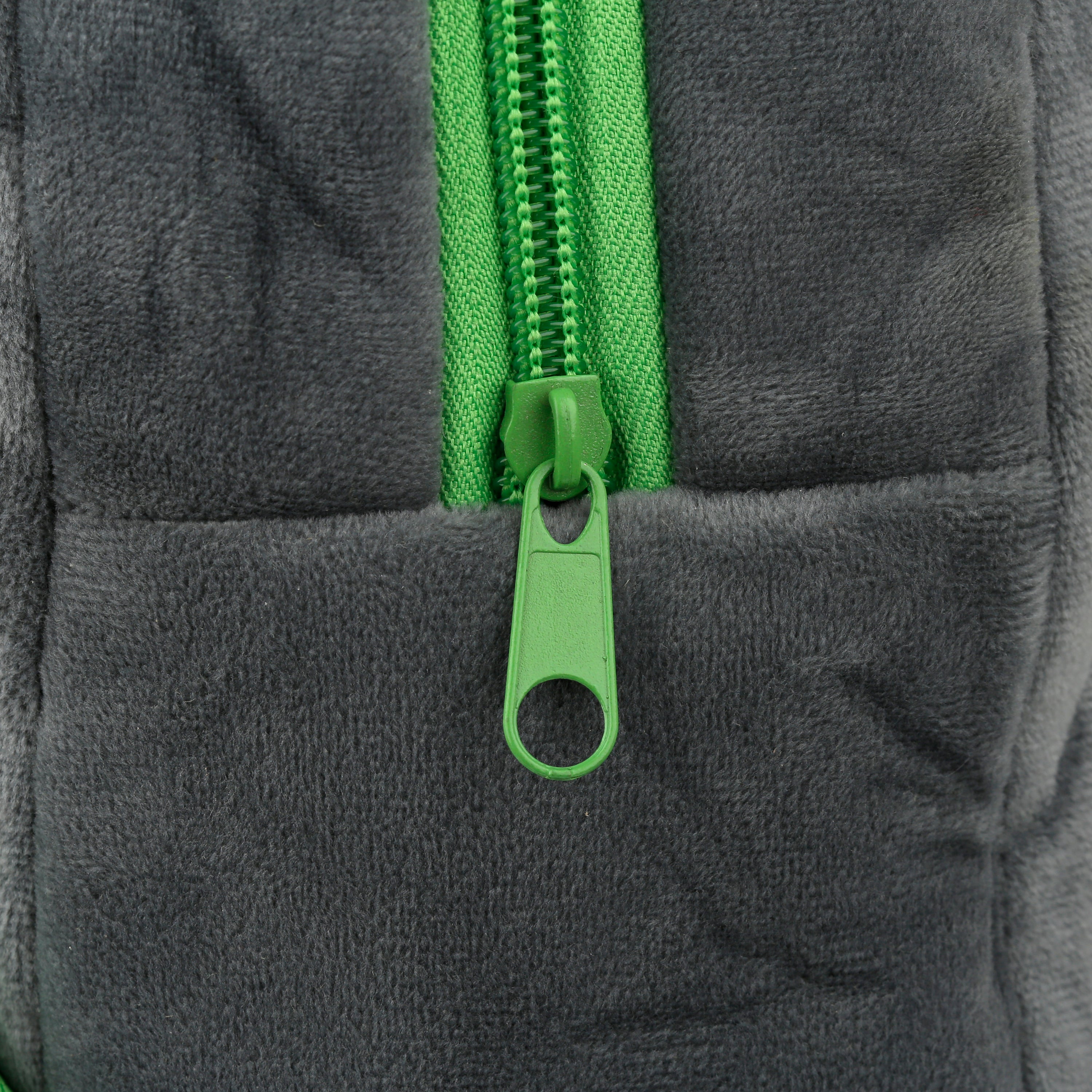 Close-up of the bright lime green zippers on koala bag.
